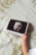 baby-s-hand-is-holding-his-photo.jpg