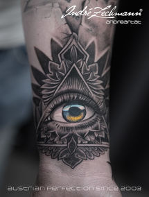 A detailed tattoo eye of providence on the arm, Andre Zechmann, Austrian Perfect on SINCE 2003.