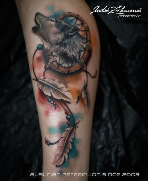 Wolf howling dreamcatcher tattoo with feathers; Austrian Perfection since 2003. Andre Zechmann.