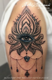 Lotus eye tattoo on the arm, Austrian imperfection since 2003, Andre Zechmann.