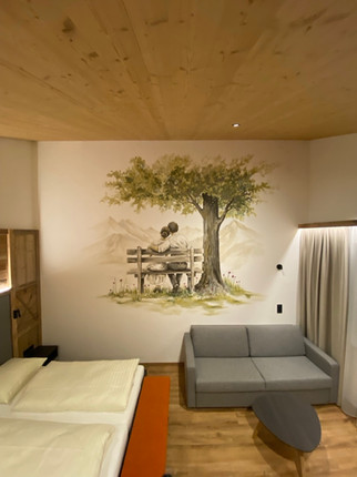 Painting on the wall, tree with people, sofa, Hotel Moser | Rohrmoos, Alpine Wall Art.