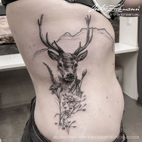 Tattoo of a deer with flowers and mountains, Andre Zechmann PICTURES FINE LINE TATTOO.