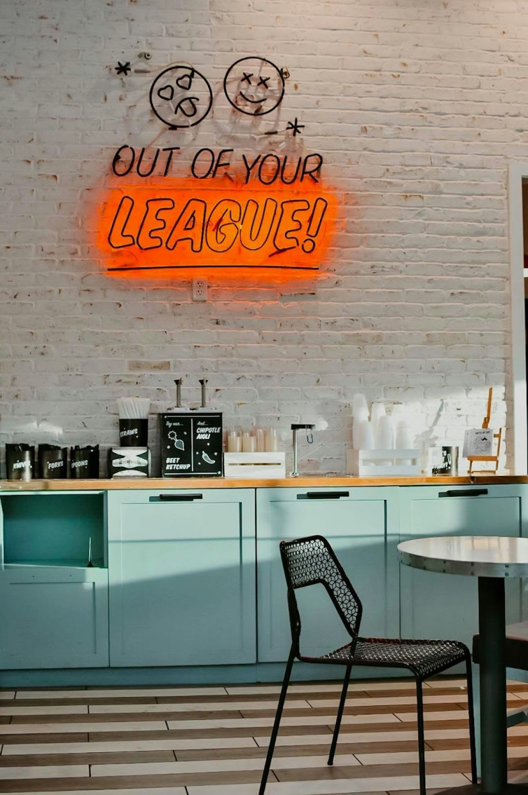 brick wall with neon sign