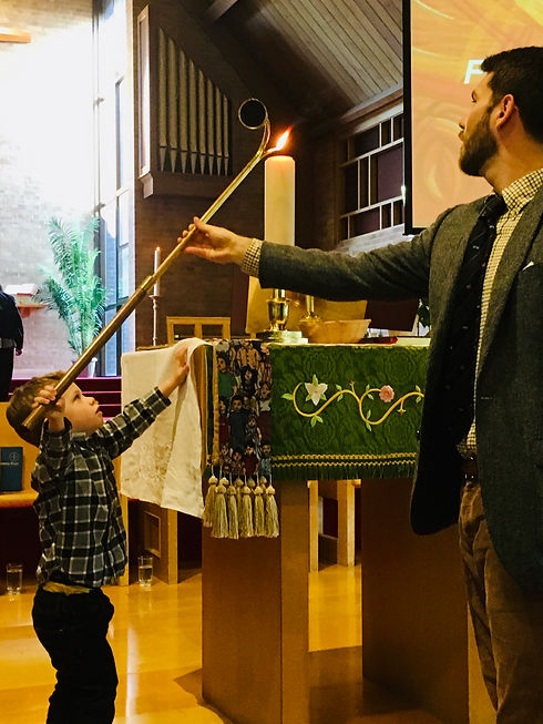 Boy Lighting Candle.jpeg