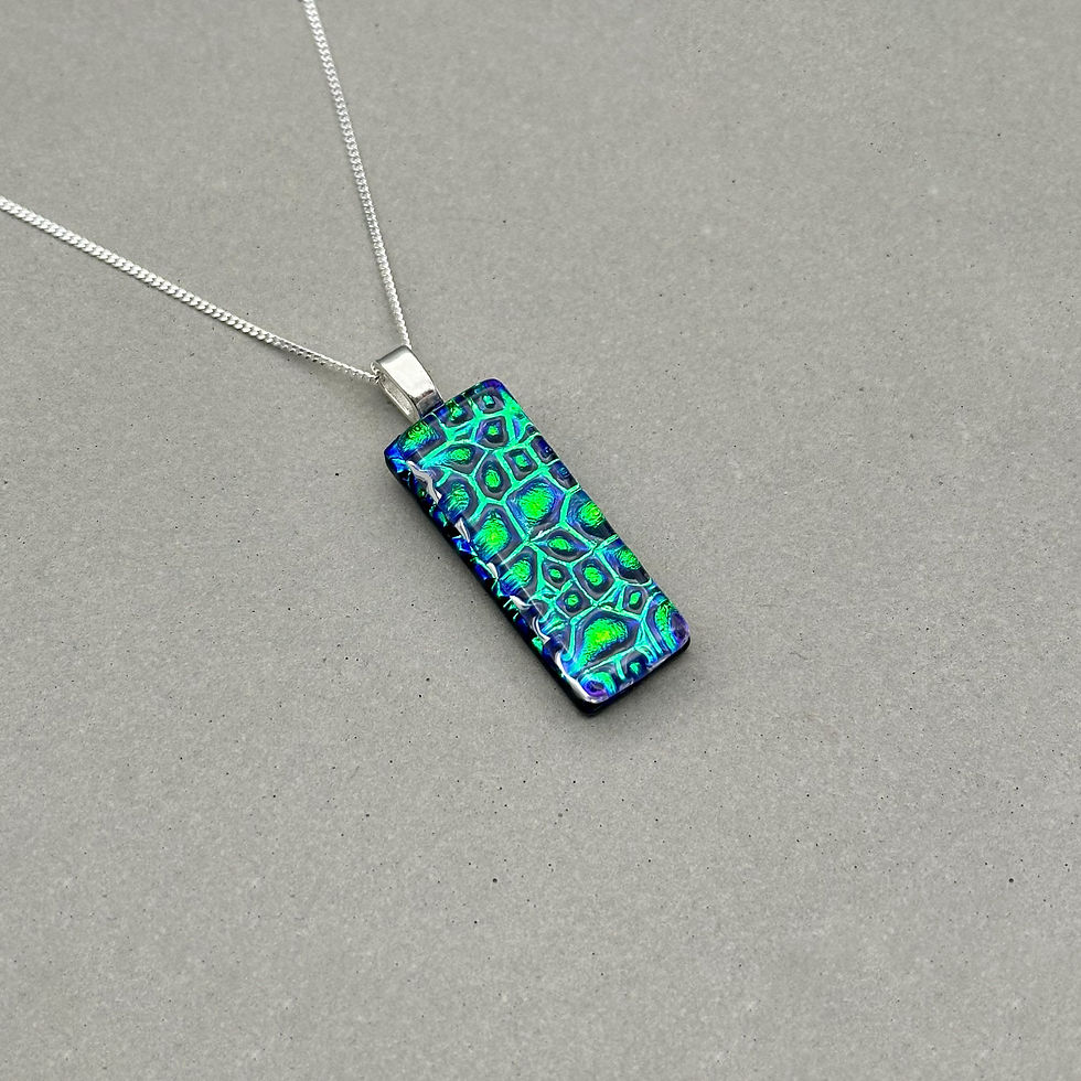 Thumbnail: Handmade emerald green reaindrop dichroic fused glass pendant with colour-shifting effect by Jade Tapson.