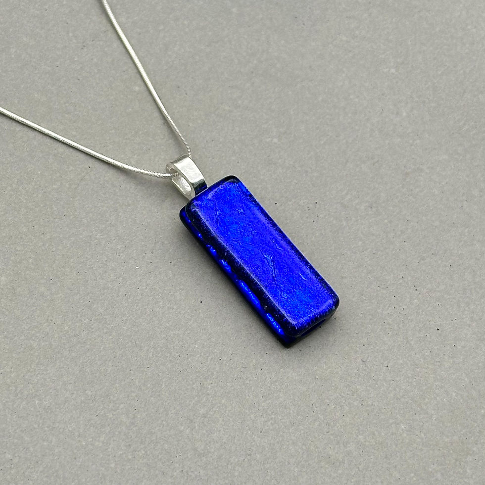 Thumbnail: Handmade cobalt blue dichroic fused glass pendant with colour-shifting effect by Jade Tapson.
