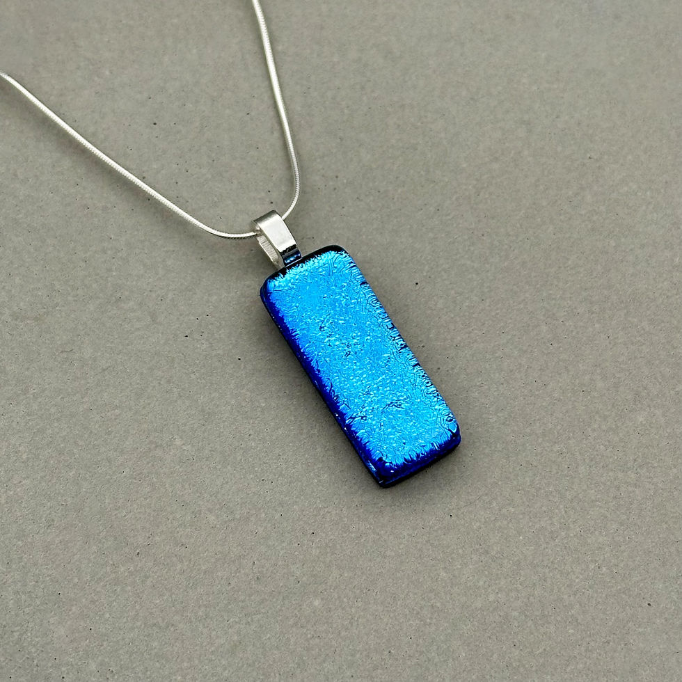 Thumbnail: Handmade turquoise dichroic fused glass pendant with colour-shifting effect by Jade Tapson.