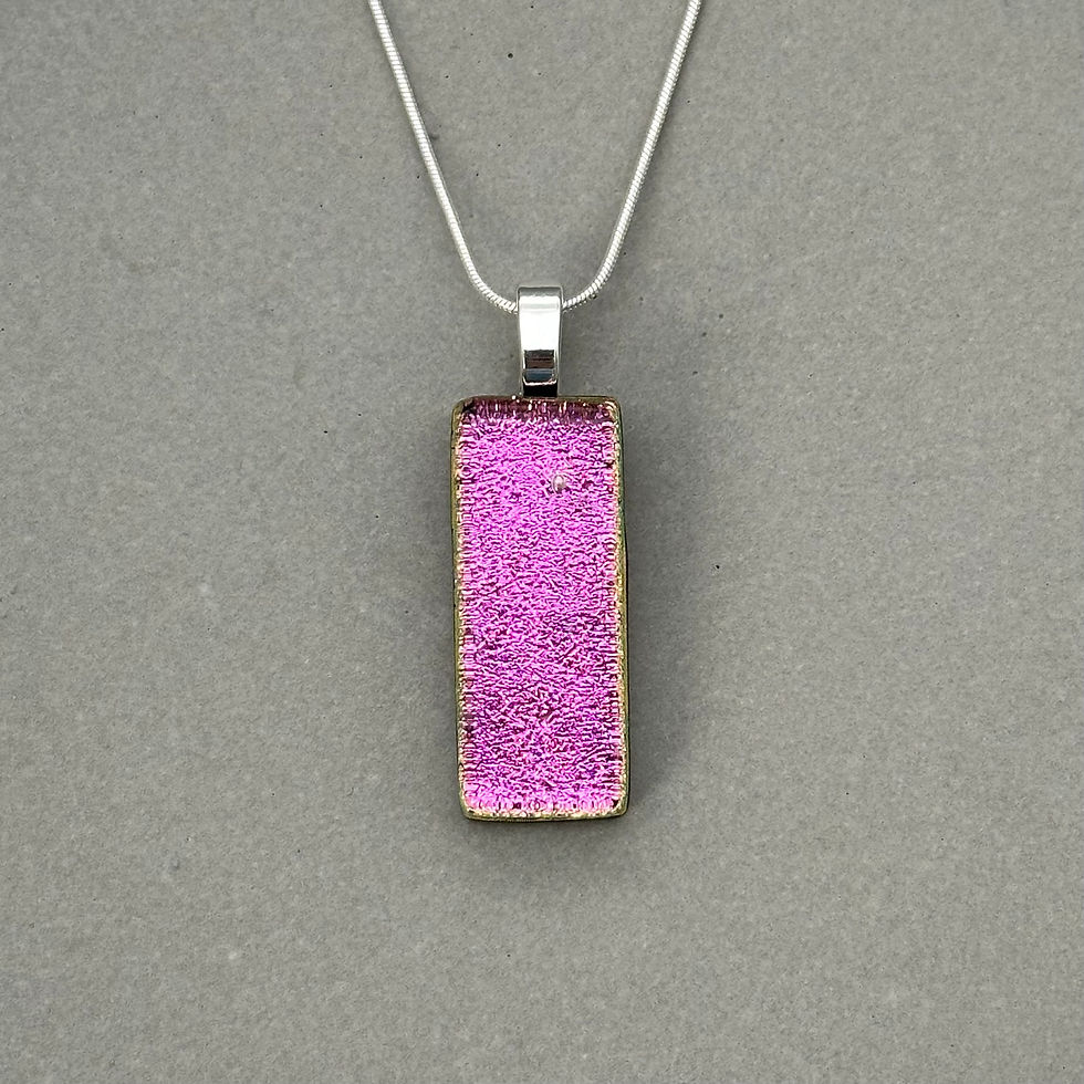 Thumbnail: Handmade pink dichroic fused glass pendant with colour-shifting effect by Jade Tapson.