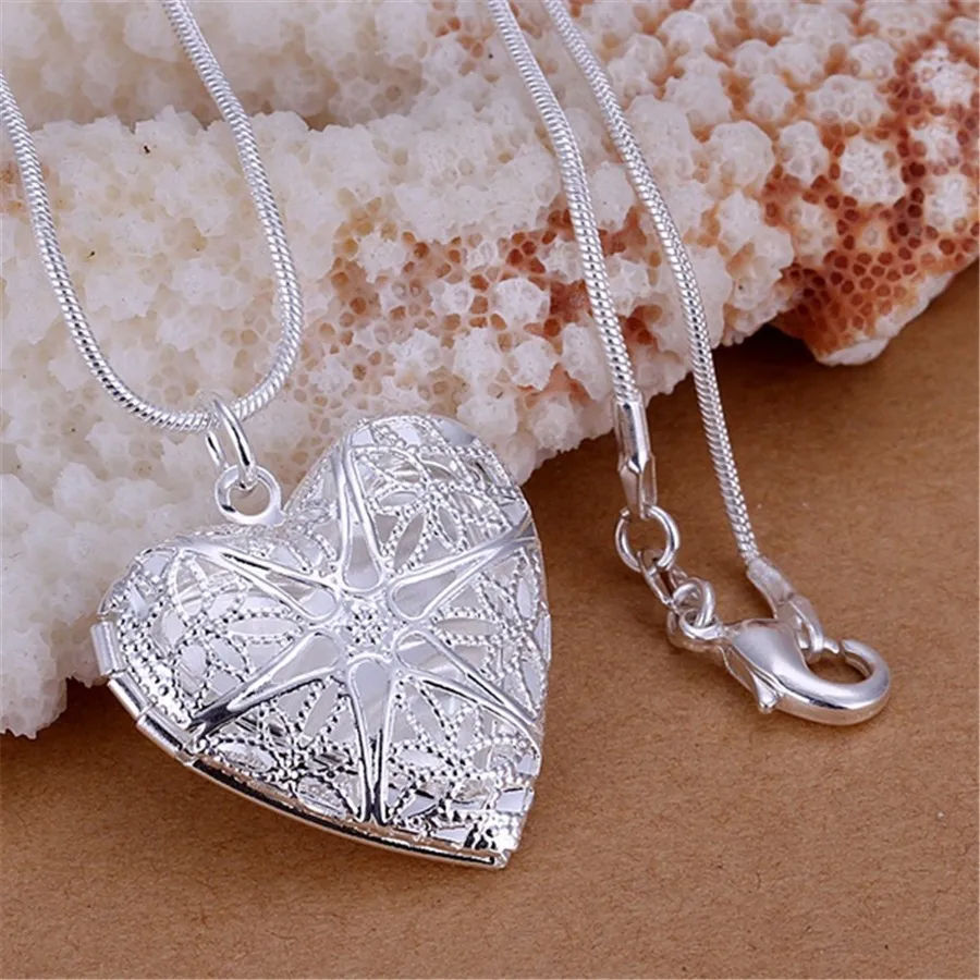 Thumbnail: Necklaces with an open-frame photo pendant in the shape of an oval heart, made o