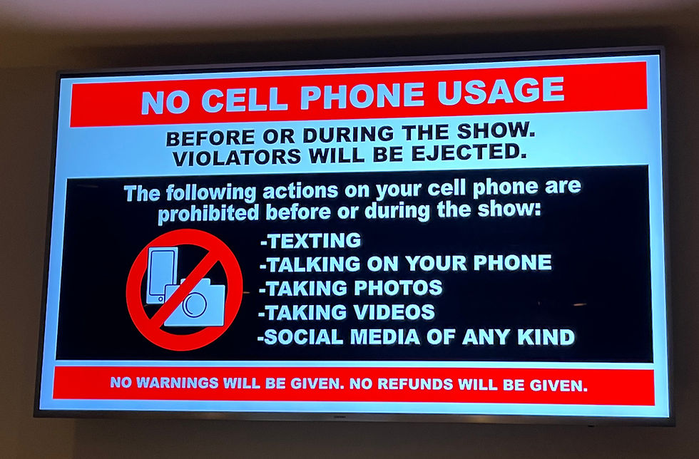 No cell phone usage video display specifying that violators will be ejected for texting, photos, and making videos with no warning given.