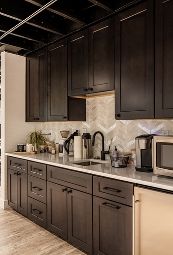 Complimentary coffee station and full kitchen at The Forty Two Sixty coworking space in Denver