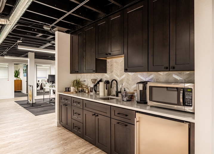 Complimentary coffee station and full kitchen at The Forty Two Sixty coworking space in Denver