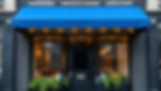 4K image of pacific blue awning over a black brick storefront.jpg