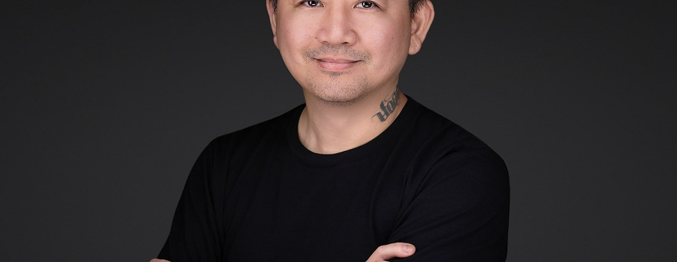 Studio headshot of man in black clothing for Central Coast Sign and Design.