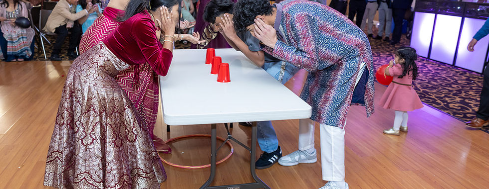Guests playing traditional games during Diwali celebrations in Monterey Bay.