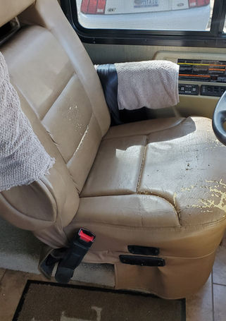 Torn and worn RV captain's chair before reupholstery