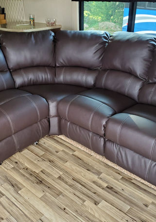 Reupholstered dark brown leather reclining RV sofa