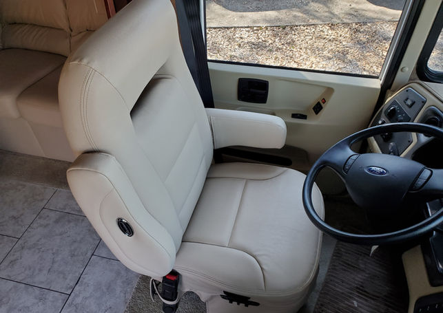 RV driver's captain chair reupholstered in tan leather