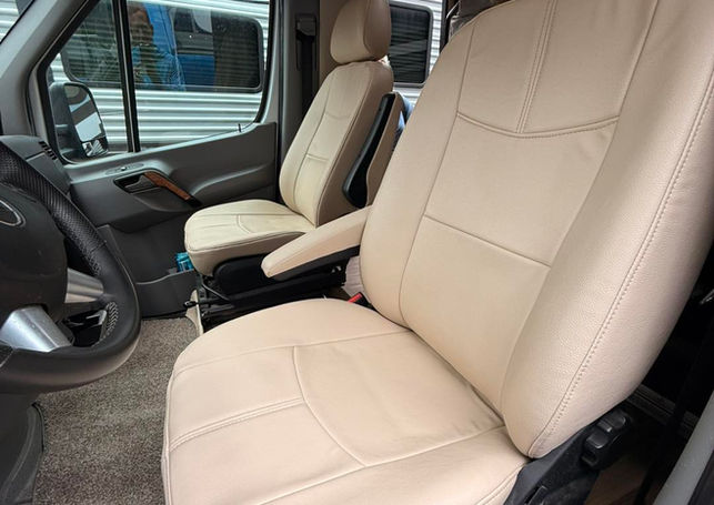 Two RV captain's chairs reupholstered in tan leather