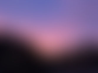 Vibrant pink and purple clouds fill the evening sky above silhouetted trees, reflecting the beauty of creation and the theme of Let There Be Light.