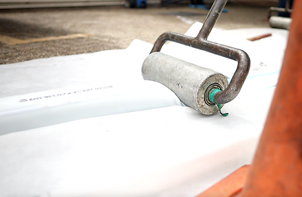 epoxy being rolled into the liner