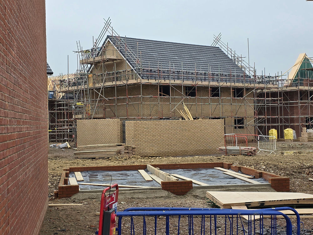 Residential construction project with houses and scaffolding
