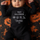 Thumbnail: Baby wearing a black personalised My first halloween romper with name. Cute halloween icons including pumpkin, ghost, witch