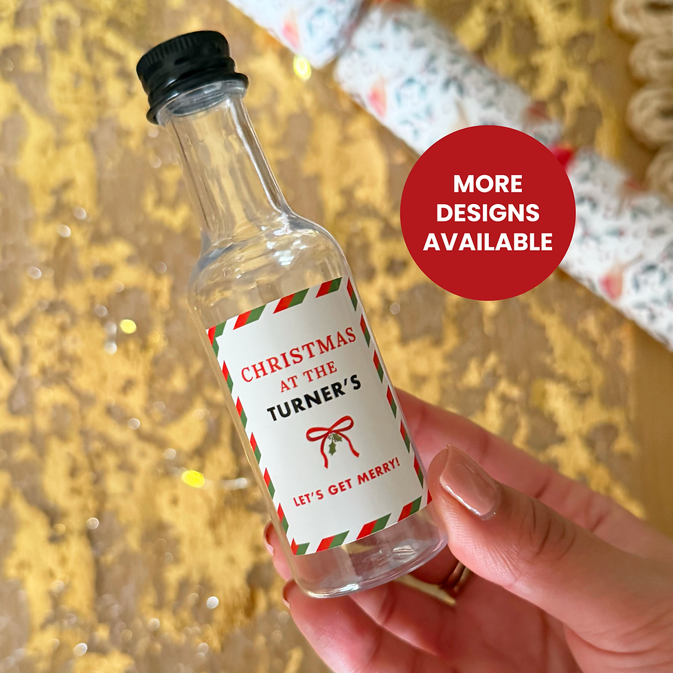 Holding a 50ml mini bottle with a personalised christmas design label. Red & Green striped design with a bow