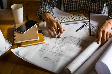 creative-architect-projecting-big-drawin
