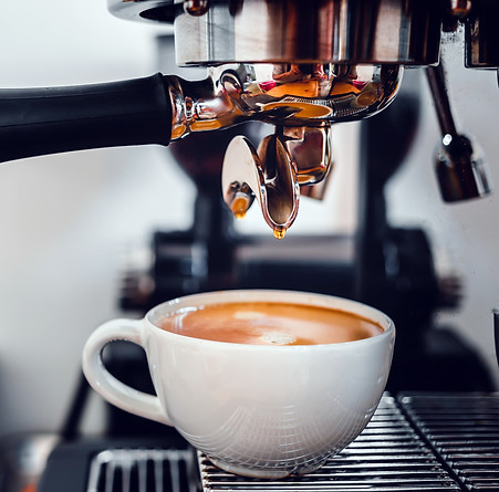 vecteezy_coffee-extraction-from-the-coffee-machine-with-a-portafilter_14945244.jpg