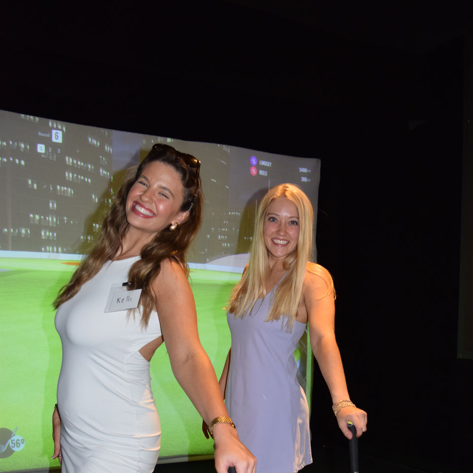 2 girls playing golf