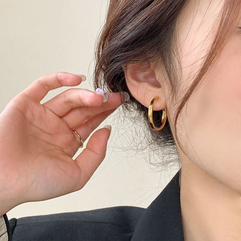 Thumbnail: Gold hoop earring worn with Celestial Layered Lariat