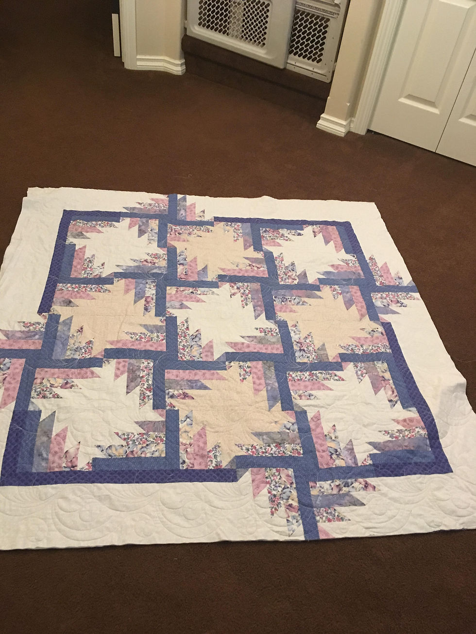 Intricate feather quilt