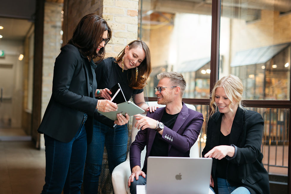 A group of fractional CTOs working together at a table