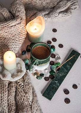 cacao cup with crystals and candles.jpeg