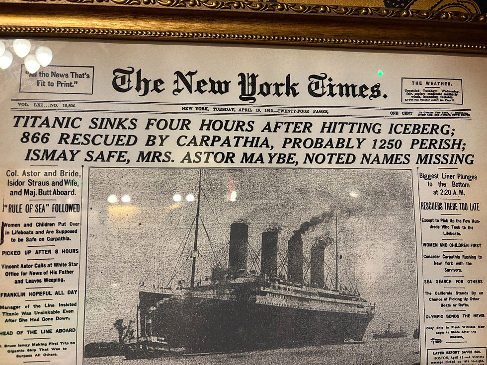 Framed 1912 newspaper headline from The New York Times about Titanic's sinking. 