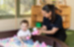 Child Playing with Educator Childcare
