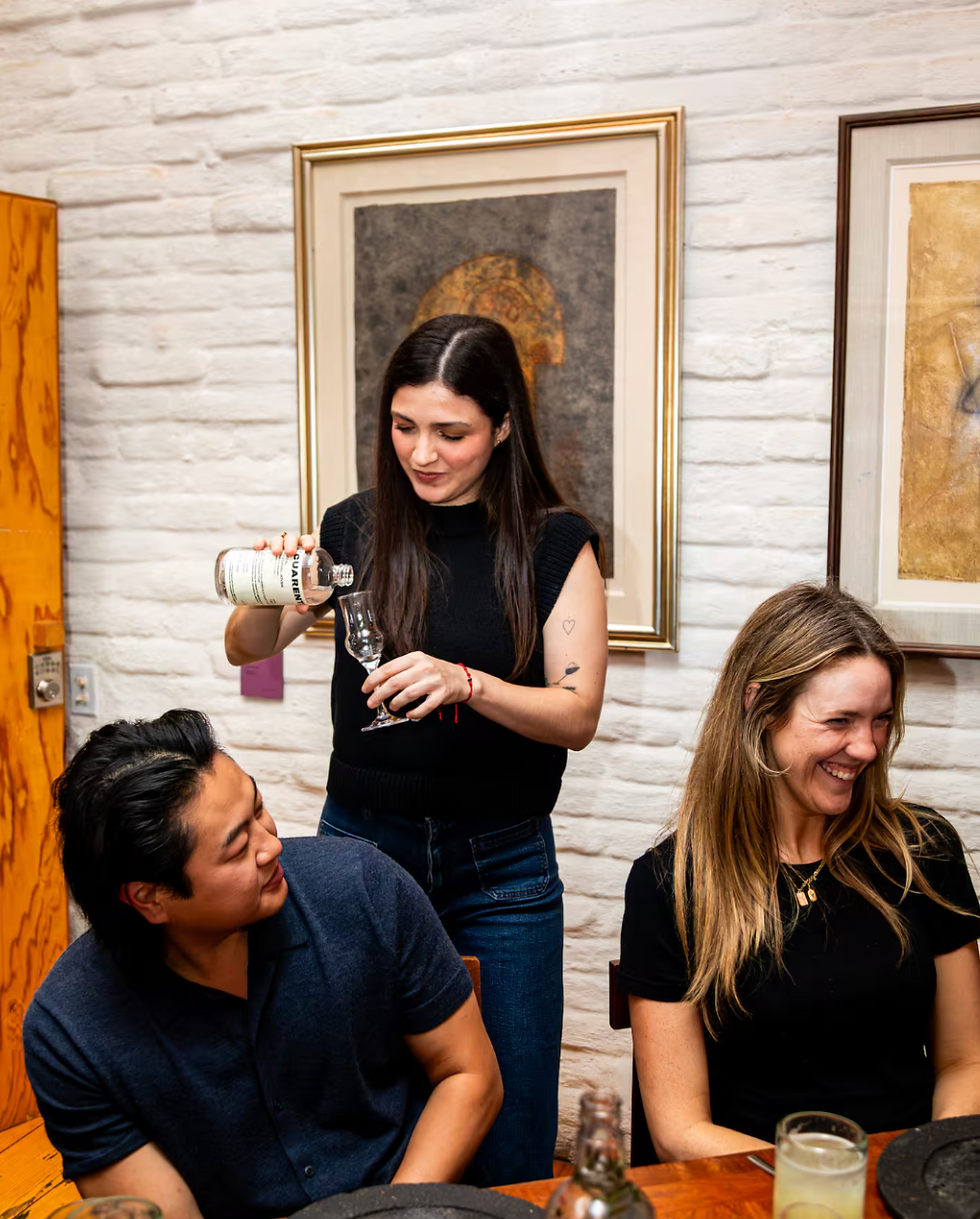 Professional mezcalier at mezcal tasting serving mezcal