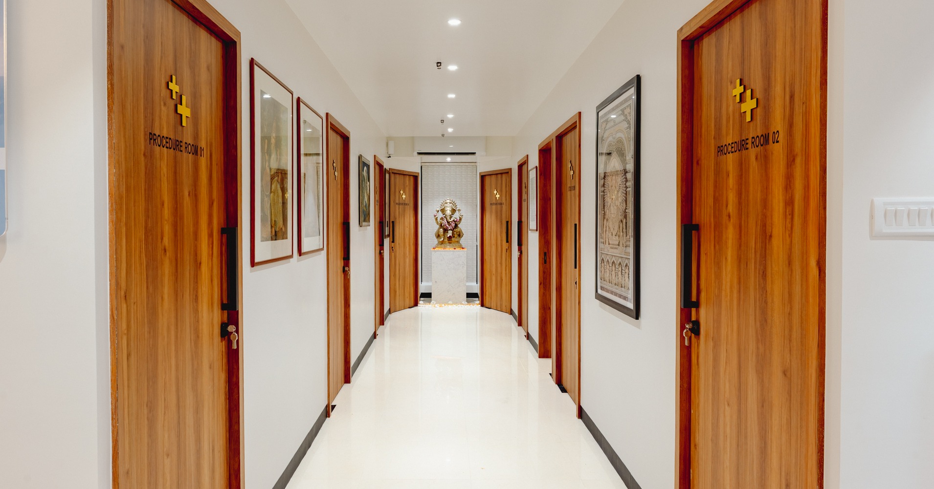 A corridor inside Dr. Sheth's Skin & Hair Clinics, with procedure-room doors on both sides