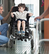 Doctor Talking to Boy in Wheelchair
