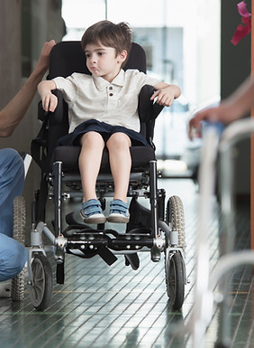 Doctor Talking to Boy in Wheelchair