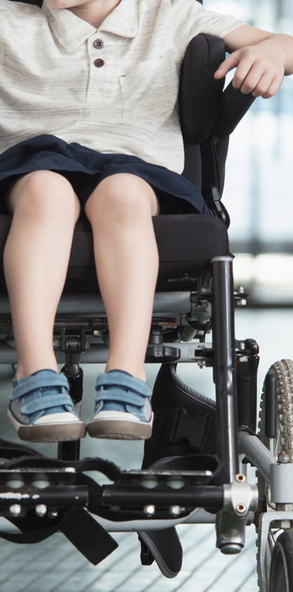 Doctor Talking to Boy in Wheelchair
