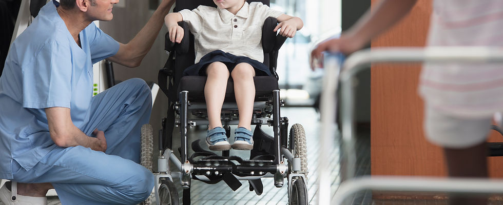 Doctor Talking to Boy in Wheelchair