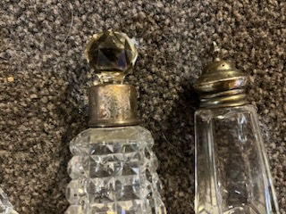 Thumbnail: Four perfume bottles with sterling silver tops 