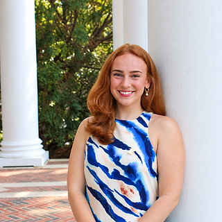 Smiling Auburn Portrait by the Colonnade.png