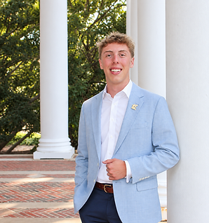 Smiling Student by Classical Columns.png