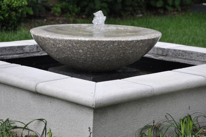 Custom designed fountain made from concrete, paving and a sourced terrazzo bowl.