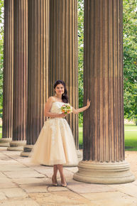 Bride posing at Downing College Cambridge