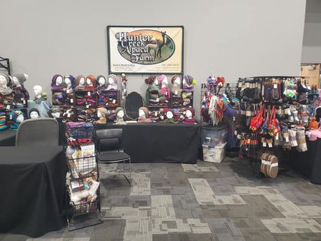 Hunter Creek Alpaca Farm booth with knitted accessories