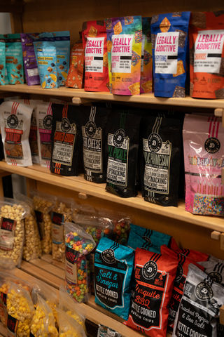 Variety of snacks and popcorn on shelves